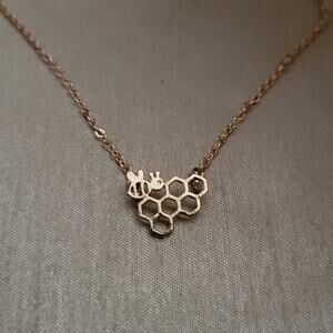 Gold tone bee and honeycomb and bumblebee necklace